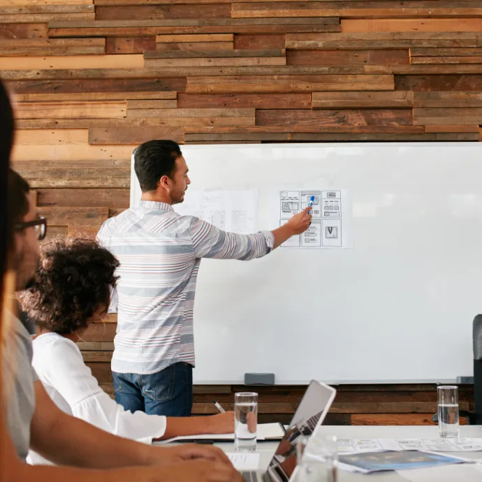 A web design meeting with a team of people discussing UX best practices